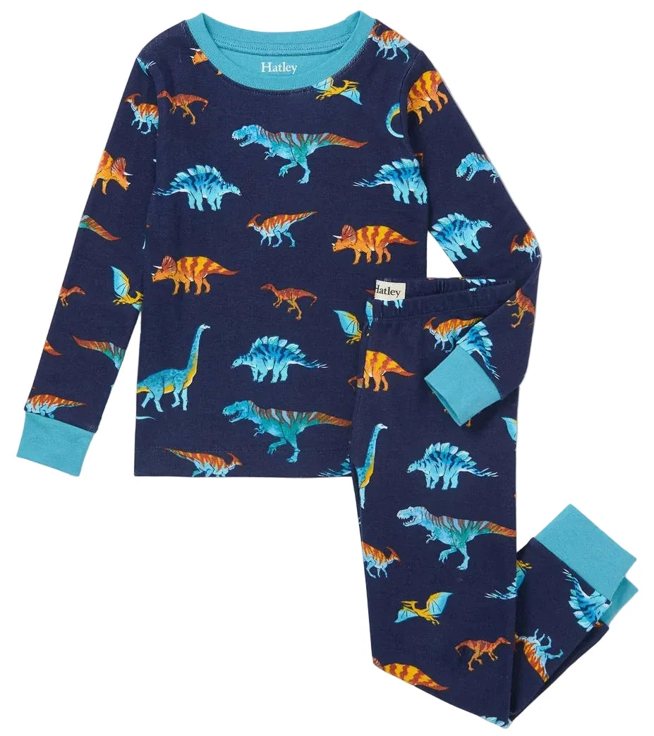 The Boys’ Colourful Dinos Cotton Rib Pajama Set by Hatley, featuring a navy blue base and light blue cuffs, is adorned with vibrant dinosaur prints and displayed flat against a white background. Made from soft organic cotton, these cozy pajamas offer sustainable and comfortable sleepwear for kids.