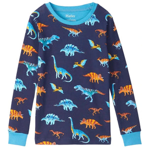 Hatley’s Boys’ Colourful Dinos Cotton Rib Pajama Set features a long-sleeve navy blue shirt adorned with vibrant orange, blue, and yellow dinosaur illustrations, including various species, and is finished with light blue collar and cuffs. Made from soft organic cotton, these cozy pajamas are perfect sleepwear for dinosaur-loving kids.