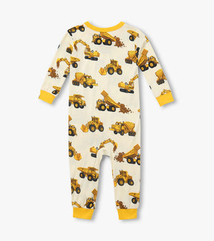 Hatley’s Baby Boys’ Construction Trucks Bamboo Overall features long sleeves, yellow cuffs, and a cream background adorned with an all-over print of yellow and brown construction trucks.