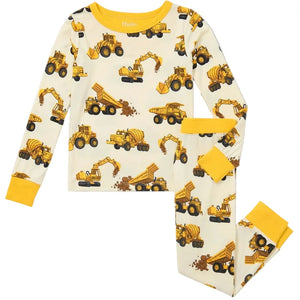 The Hatley Boys’ Construction Trucks Bamboo Pajama Set features long sleeves and pants with a cream background, yellow cuffs, and a fun yellow construction vehicle pattern—these cozy pajamas are perfect sleepwear for kids.