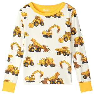 The Hatley Boys’ Construction Trucks Bamboo Pajama Set features a children’s long-sleeve shirt with a yellow neckline and cuffs, decorated with an all-over print of dump trucks, excavators, and cement mixers. Crafted from soft bamboo jersey, these pajamas are perfect for cozy nights and comfortable kids’ sleepwear.