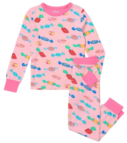 Hatley’s Girls’ Delicious Candies Bamboo Pajama Set features long sleeves and pants in pink, decorated with a colorful candy print and finished with solid pink cuffs and neckline.