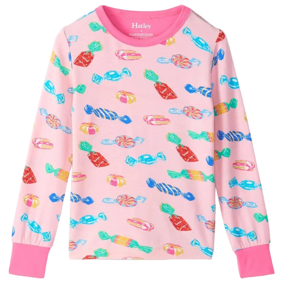 The Hatley Girls’ Delicious Candies Bamboo Pajama Set features a pink long-sleeve children’s shirt adorned with a colorful candy print, showcasing various wrapped sweets in blue, red, and yellow, and finished with pink cuffs—ideal for cozy bedtime wear.