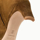 Close-up of the heel and sole of a brown Staud Wally Suede Ankle Boot, with “STAND” and “MADE IN PORTUGAL” stamped on the light-colored sole—emphasizing the everyday versatility of this boot.