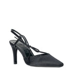 A Staud Inez Heel is shown against a white background, featuring a black high-heeled slingback design with a pointed toe, thin heel, elastic back strap, and decorative front strap.