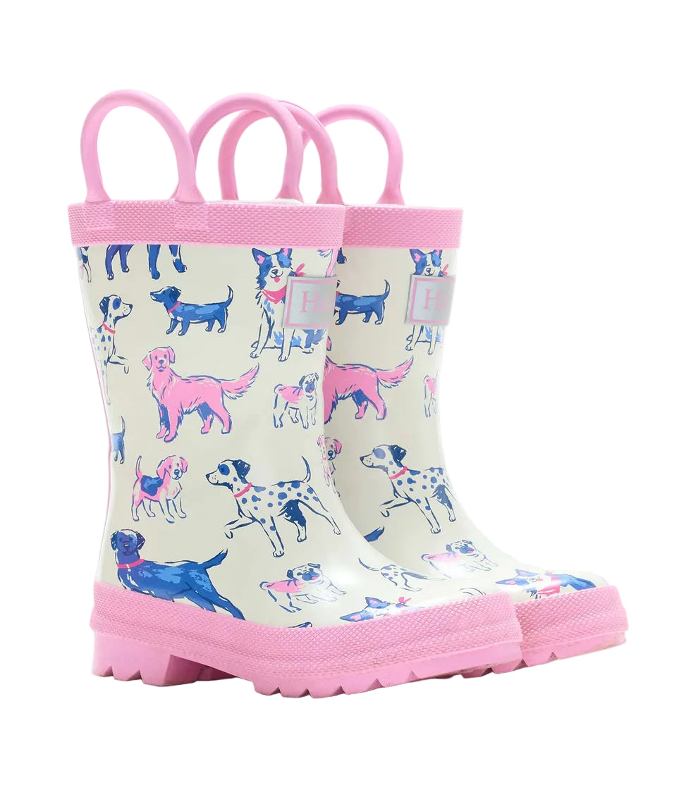 Hatley Girls’ Little Pups Rain Boots feature an adorable illustrated pups print in various colors on a light background, accented with pink soles and trim. Designed for toddlers, these boots offer slip-resistant soles for extra safety and fun on rainy days.