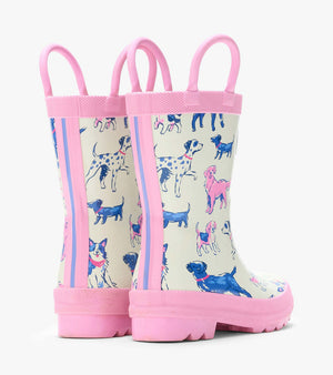 The Girls’ Little Pups Rain Boots by Hatley feature pink soles and trim, a slip-resistant design, and an illustrated pups print in shades of blue, pink, and purple on a white background. These adorable toddler boots are shown from the back and side.