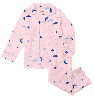 Hatley Girls’ Night Sky Relaxed Fit Pajama Set features long sleeves and pants made from soft brushed rib fabric, adorned with blue clouds, moons, stars, and pink star patterns for a cozy sleepwear set she’ll love.