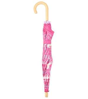 Closed Unicorn Forest Umbrella by Hatley, featuring a curved wooden handle and a whimsical unicorn and forest print, standing upright against a white background—a delightful accessory perfect for brightening up any rainy day.