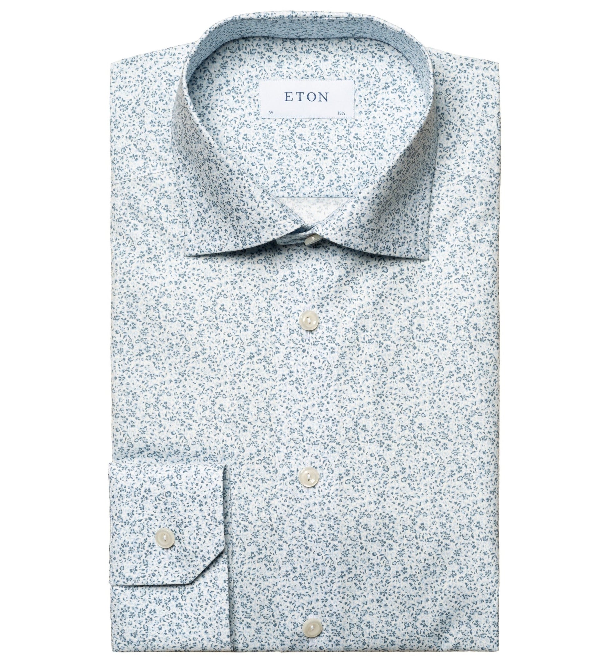 A folded light blue Eton Micro Floral Poplin Shirt men's dress shirt with a pointed collar and visible label reading "Eton.