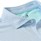 Close-up of the Johnnie-O Michael Polo, featuring a light blue color with thin white stripes, a contrasting light blue inner collar lining, and moisture-wicking fabric for all-day comfort.