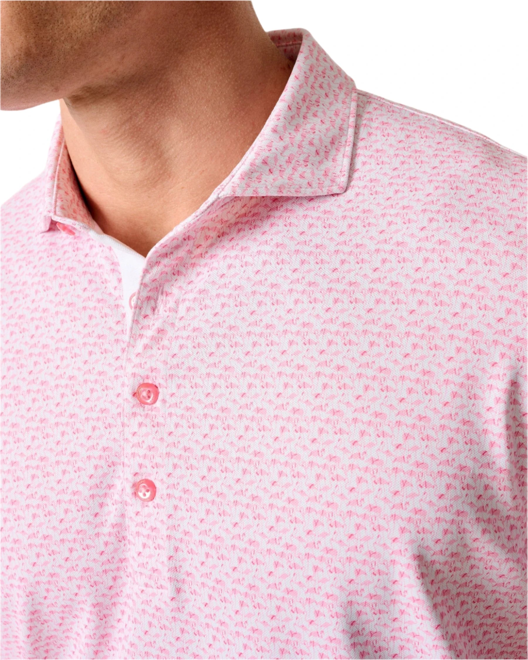 Close-up of a person wearing the Johnnie-O Flock Yeah Performance Mesh Polo, featuring a pink and white collared design with a small repeating pattern and three pink buttons—ideal for stylish golf attire.