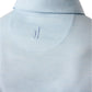 Close-up of the back of the Johnnie-O Huronn Featherweight Performance Polo in light blue, featuring a small embroidered surfer below the collar and moisture-wicking fabric for all-day comfort.