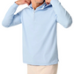 A man in a Johnnie-O Robby Performance 1/4-Zip Hybrid Hoodie, light blue, pairs it with beige pants and adjusts the collar while facing slightly right against a plain background.