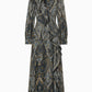 The long-sleeved Sabrina Silk Dress by Ulla Johnson showcases a paisley print in dark blue and beige tones, beautifully crafted from luxurious silk crepe de chine, and features elegant ruffle details with an asymmetrical accent on the front.