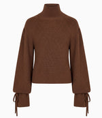 The Ulla Johnson Camille Knit Pullover is a brown ribbed knit sweater featuring a high neck, elongated wide long sleeves, and tied cuffs, shown against a plain white background.