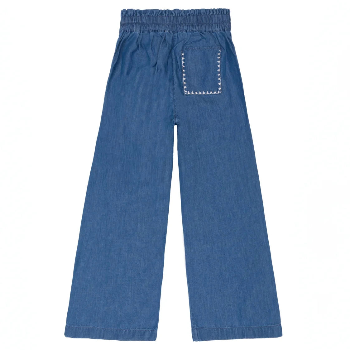 The Minnow Girls' Chambray Embroidered Paperbag Pant features blue denim, a comfy elastic waistband, wide legs, and a single back patch pocket with zigzag stitching.