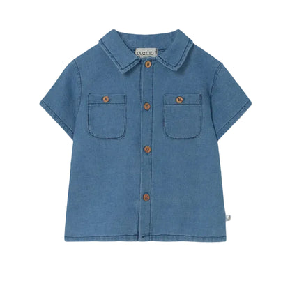 The Cozmo Baby Boys' Forest Chambray Shirt features blue denim, short sleeves, two chest pockets, brown buttons, and a collar, shown on a white background.