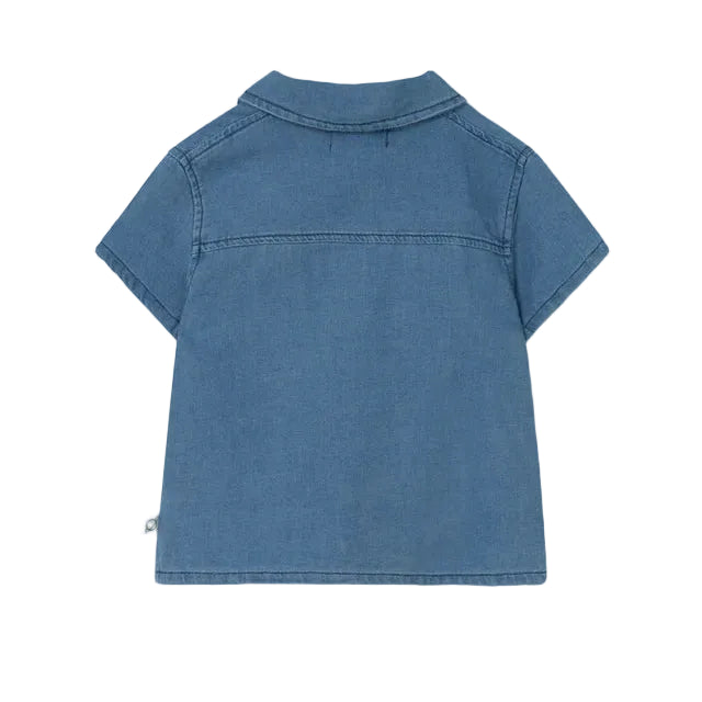 The Cozmo Baby Boys' Forest Chambray Shirt is a short-sleeved, light blue denim shirt with a collar and visible seam details, shown from the back.