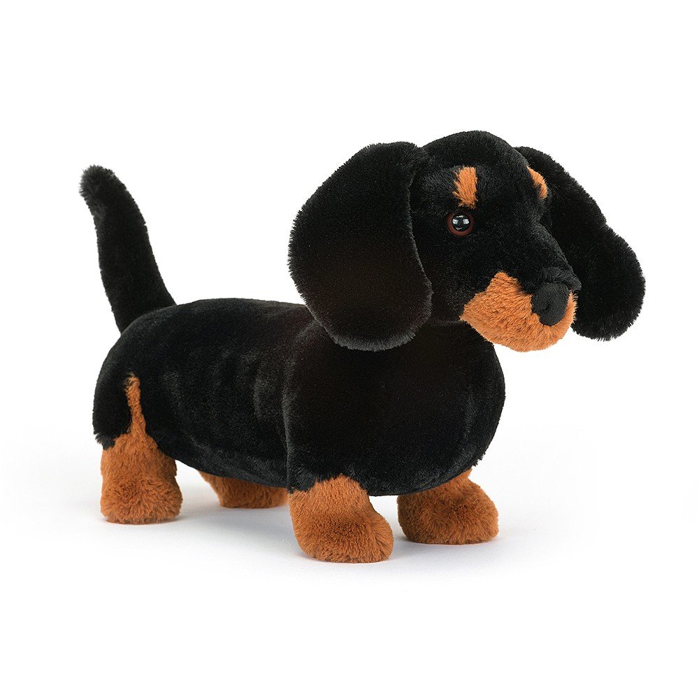 Freddie Sausage Dog, a black and brown dachshund stuffed animal by Jellycat.