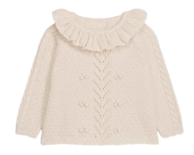 The Louise Misha Baby Girls' Evina Sweater is a cream knit with a ruffled Pierrot collar, decorative front stitches, and cable knit sleeve details.