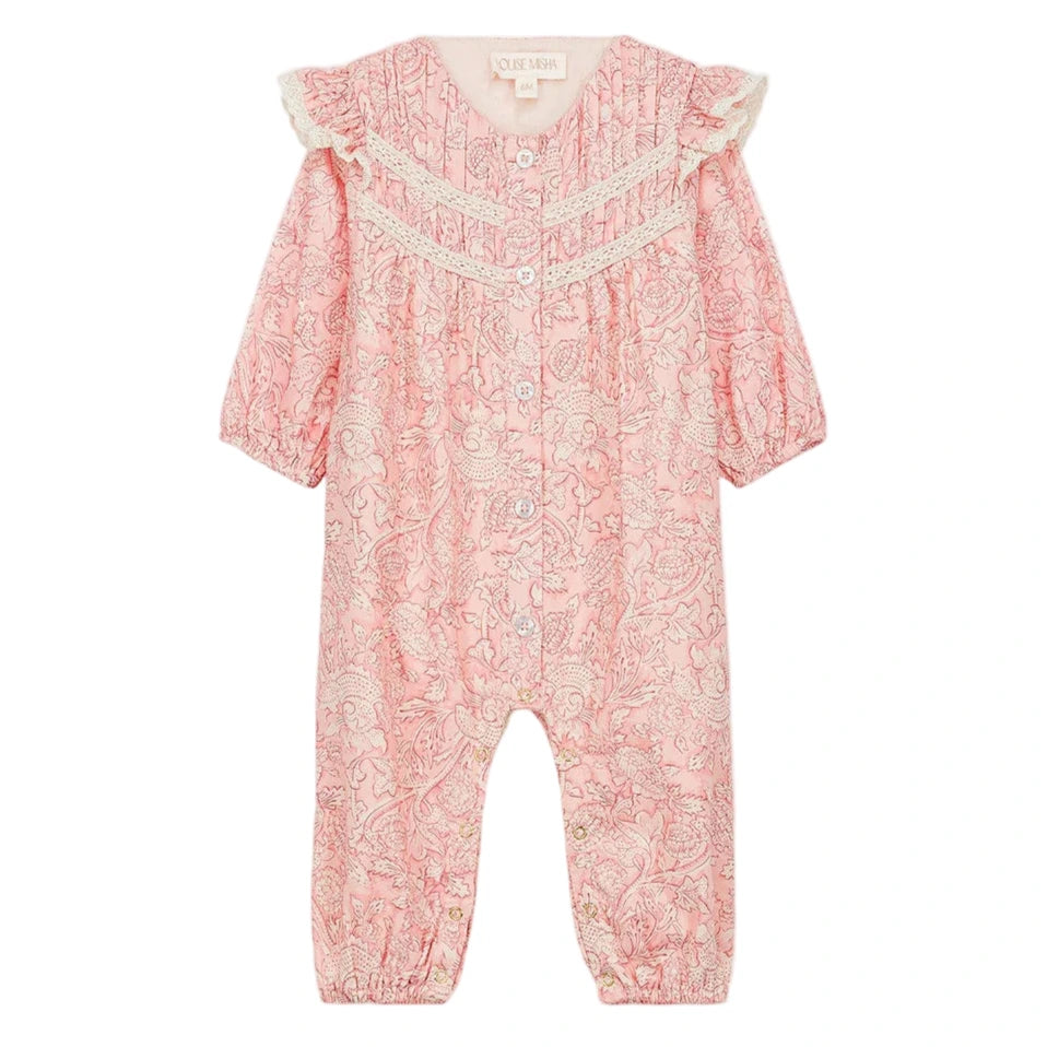 The Louise Misha Baby Girls' Lilany Jumpsuit features a pink base with a white floral pattern, long sleeves, lace shoulder details, ruffled armholes, button-down front, and elastic cuffs at wrists and ankles.