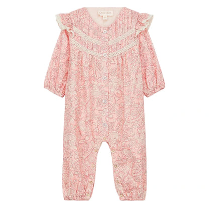 The Louise Misha Baby Girls' Lilany Jumpsuit features a pink base with a white floral pattern, long sleeves, lace shoulder details, ruffled armholes, button-down front, and elastic cuffs at wrists and ankles.