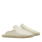 Lanvin's Domra Leather Espadrilles feature a cream color and espadrille-style woven soles. Perfect for a chic summer look, the side view against a white background highlights their elegance.