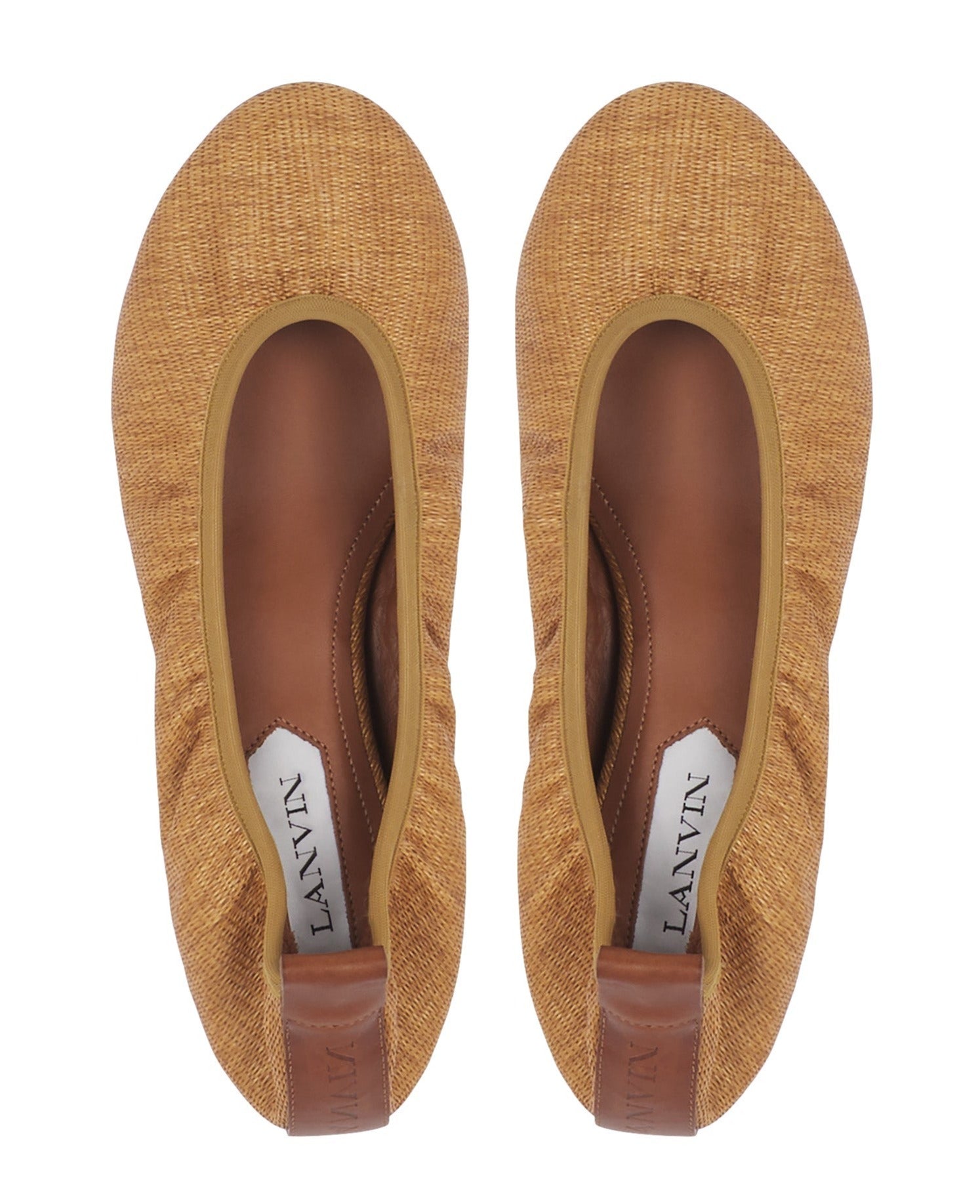 A pair of Lanvin Raffia Ballerina shoes with leather trim, featuring the Lanvin brand label inside. These elegant shoes effortlessly complement a casual outfit.