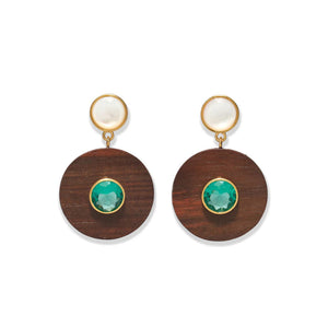 The Taj Disc Earrings by Lizzie Fortunato feature gold-plated brass, a white stud, a brown wooden circle, and a vivid green topaz centerpiece.