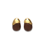 The Toro Earrings by Lizzie Fortunato feature oval-shaped acacia wood with dark brown bases and gold-plated brass caps, shown on a white background.