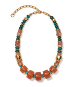 The Granada Necklace by Lizzie Fortunato features alternating large brown beads, smaller chrysocolla, and gold beads, finished with a gold chain and clasp.