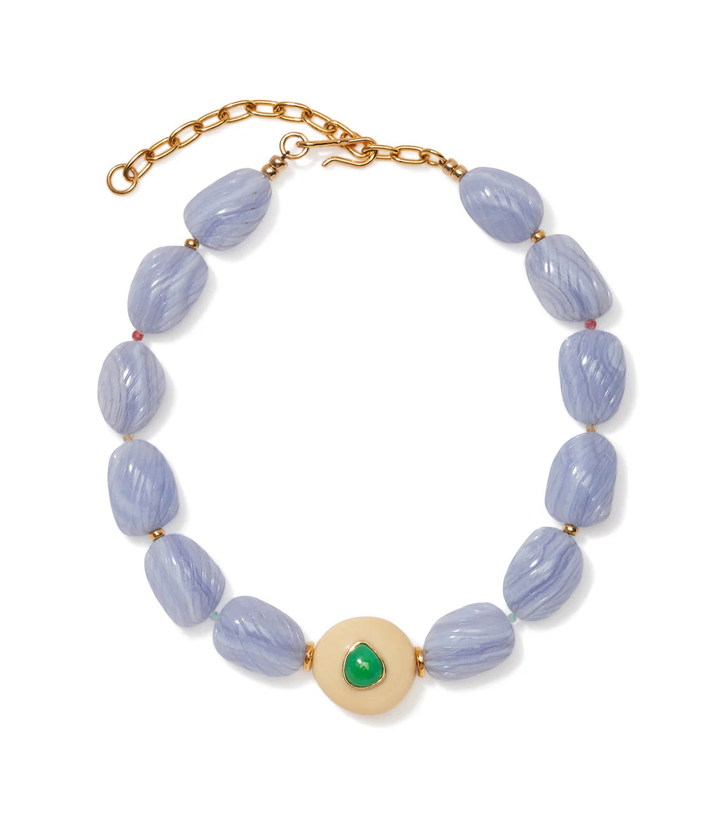 The Andalusia Collar by Lizzie Fortunato features light purple oval beads, gold spacers, an adjustable gold clasp, and a central round cream bead accented with green chrysoprase.
