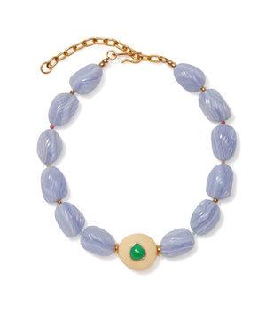 The Andalusia Collar by Lizzie Fortunato features light purple oval beads, gold spacers, an adjustable gold clasp, and a central round cream bead accented with green chrysoprase.