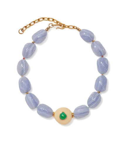 The Andalusia Collar by Lizzie Fortunato features light purple oval beads, gold spacers, an adjustable gold clasp, and a central round cream bead accented with green chrysoprase.