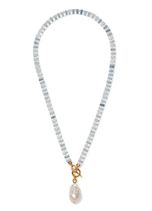The Pearl Isle Necklace by Lizzie Fortunato features alternating light blue and white beads, a gold-plated toggle clasp, and a unique baroque freshwater pearl pendant.
