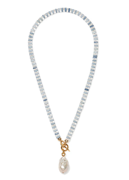 The Pearl Isle Necklace by Lizzie Fortunato features alternating light blue and white beads, a gold-plated toggle clasp, and a unique baroque freshwater pearl pendant.