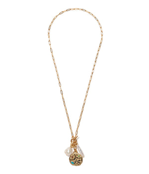 The Campo Charm Necklace by Lizzie Fortunato features a gold-plated paperclip chain, a textured round pendant, turquoise detail, and two freshwater pearl-like charms, shown on a white background.