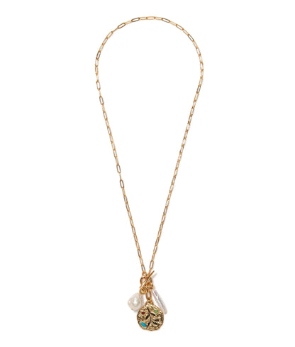 The Campo Charm Necklace by Lizzie Fortunato features a gold-plated paperclip chain, a textured round pendant, turquoise detail, and two freshwater pearl-like charms, shown on a white background.