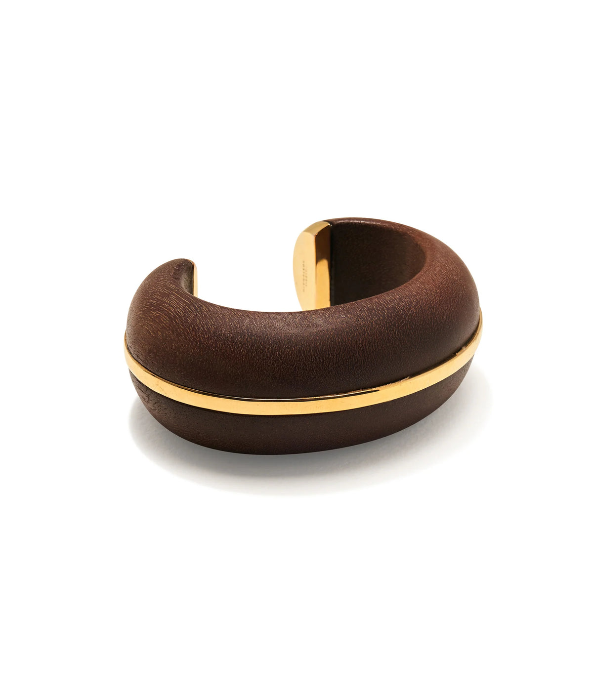 The Lizzie Fortunato Halo Cuff features a wide, dark brown acacia wood band accented by a polished gold-plated stripe encircling the center, showcased on a plain white background for an elegant statement.