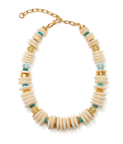 Introducing the Petra Collar by Lizzie Fortunato—a stunning gold collar necklace featuring stacked cream, gold-plated, turquoise, and yellow beads arranged in a repeating pattern along its length, and accented with elegant white bone beads for added texture.