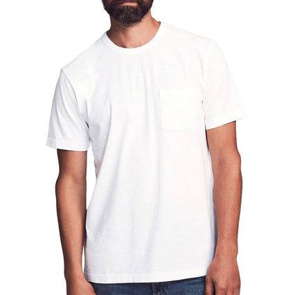 Someone is wearing the Faherty Sunwashed Pocket Tee, a plain white T-shirt with a relaxed fit and pocket, paired with classic blue jeans.