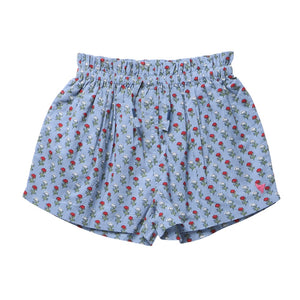 Girls’ Theodore Short by Pink Chicken in light blue, styled with an elastic waist and adorned with a delightful blockprint pattern of small red and white flowers with green leaves.