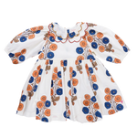 The Pink Chicken Girls' Darcy Dress features a Buttercup Floral print with puffed sleeves, a scalloped collar trimmed in red and yellow, and bright orange and blue flowers for a cheerful vintage look.