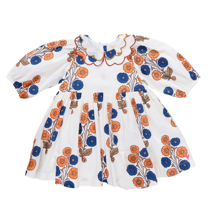 The Pink Chicken Girls' Darcy Dress features a Buttercup Floral print with puffed sleeves, a scalloped collar trimmed in red and yellow, and bright orange and blue flowers for a cheerful vintage look.