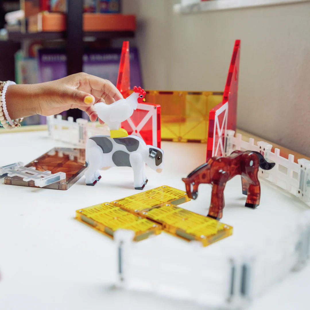 Little hands playing with Magnatiles Farm Animal Collection