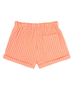 The Feather 4 Arrow Girls’ Salty Short features pink and orange striped gauze fabric with an elastic waistband, rolled cuffs, and a single back pocket, shown on a white background for a relaxed, casual style.