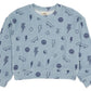 The Feather 4 Arrow Baby Boys’ and Boys’ Icon Hacci Set features a light blue sweatshirt adorned with dark blue prints of lightning bolts, smiley faces, peace signs, flags, and skateboards. Made from ultra-soft hacci fabric for maximum comfort, this kids’ loungewear set is shown laid flat on a white background.