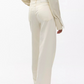 Person wearing an off-white long-sleeve shirt and Rag & Bone Featherweight Logan high-waisted wide leg jeans, photographed from the back against a plain background.