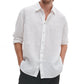 A person wears the Finch Linen Shirt by Rag & Bone—a relaxed fit, long-sleeve white shirt with rolled-up sleeves and hands in pockets—set against a plain white background.